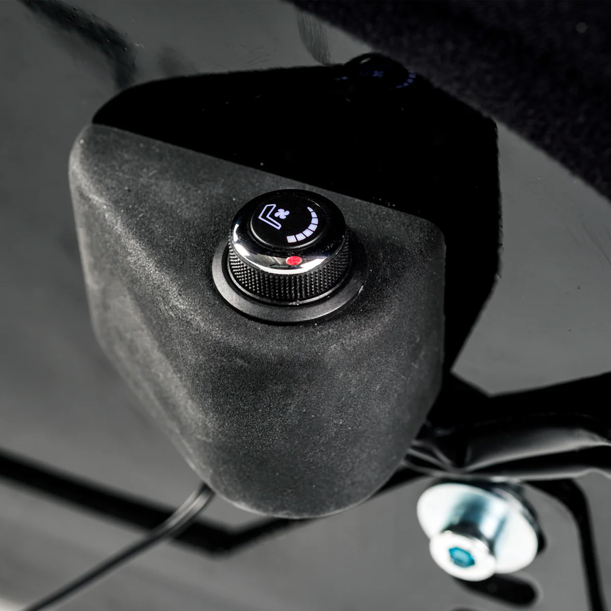 Cold Fusion rotary fan speed control dial mounted on the seat