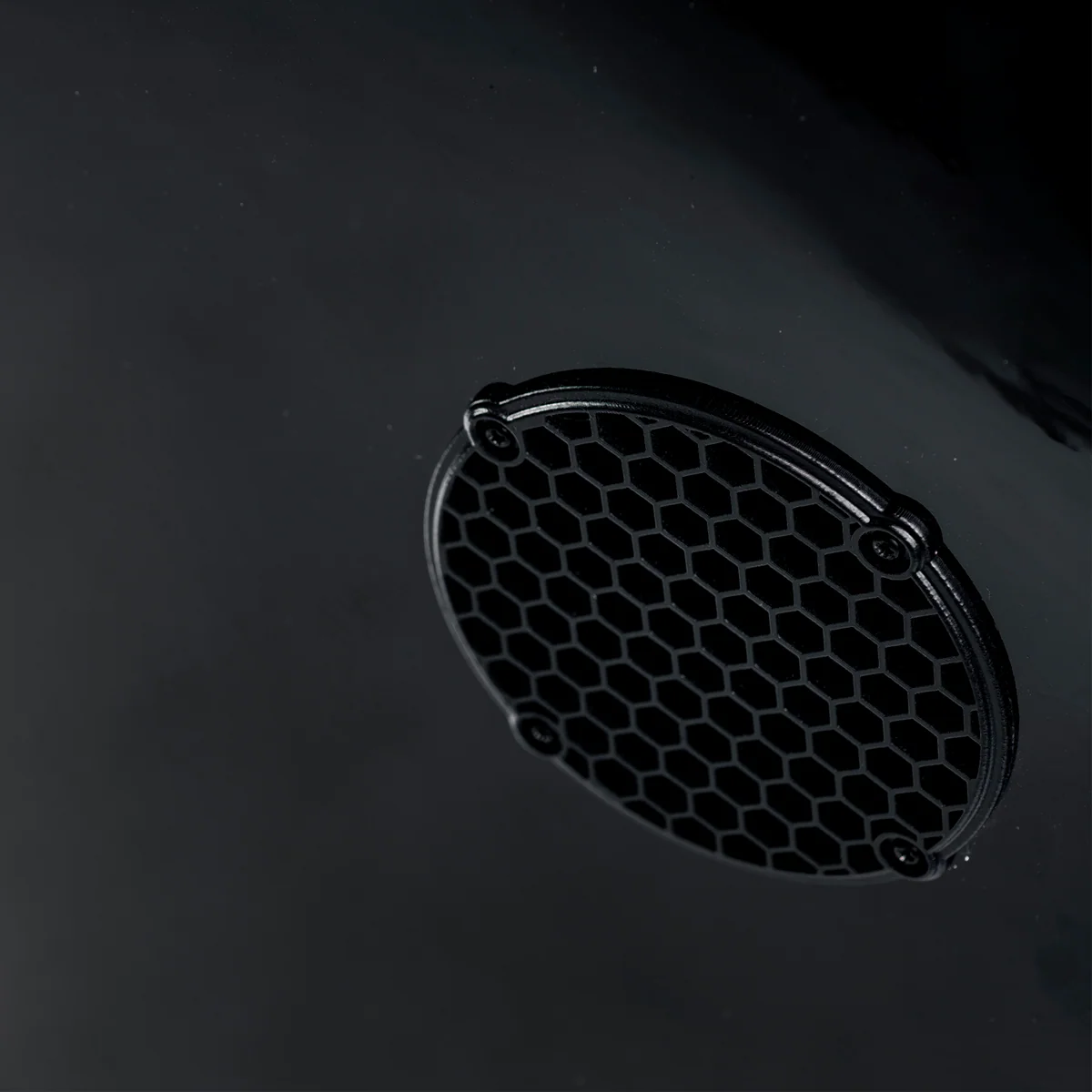 Honeycomb ventilation grille covering a Cold Fusion cooling fan